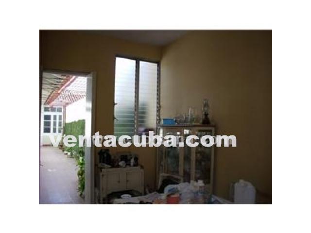 camaguey  vendo casa 5 cuartos 2 banos garaje ll..