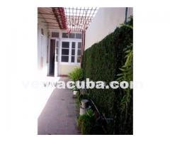 camaguey  vendo casa 5 cuartos 2 banos garaje ll..