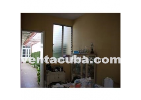 camaguey vendo casa 5 cuartos 2 banos garaje ll..
