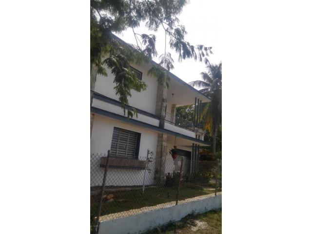I am selling a house with 2 floors with a total land of 921.38 square meters.