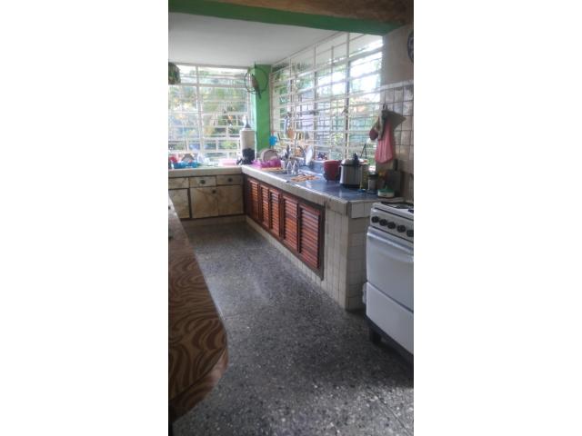 I am selling a house with 2 floors with a total land of 921.38 square meters.