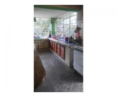 I am selling a house with 2 floors with a total land of 921.38 square meters.